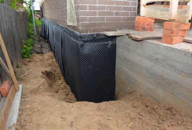 Happy homeowners after waterproofing job in West Terre Haute